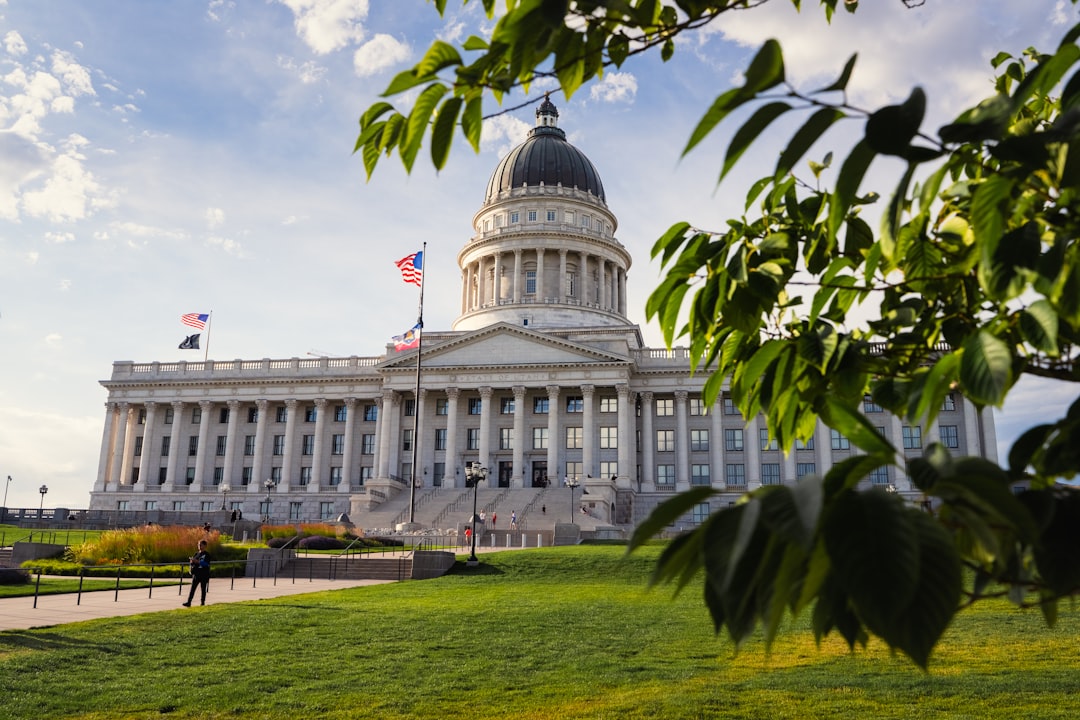 Capitol building with green trees and blue sky