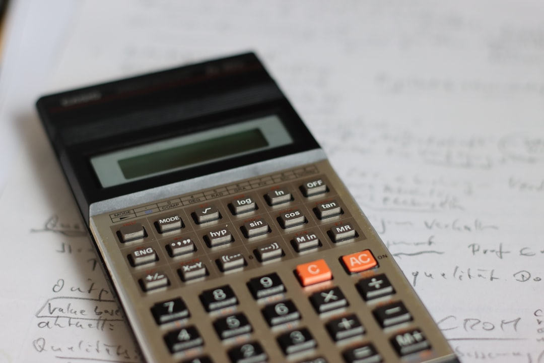 a calculator sitting on top of a piece of paper