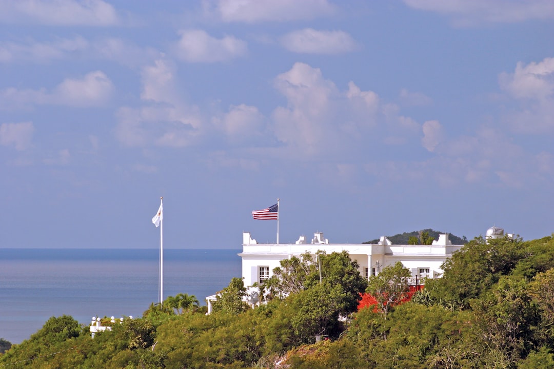 a large white building with a flag on top of it